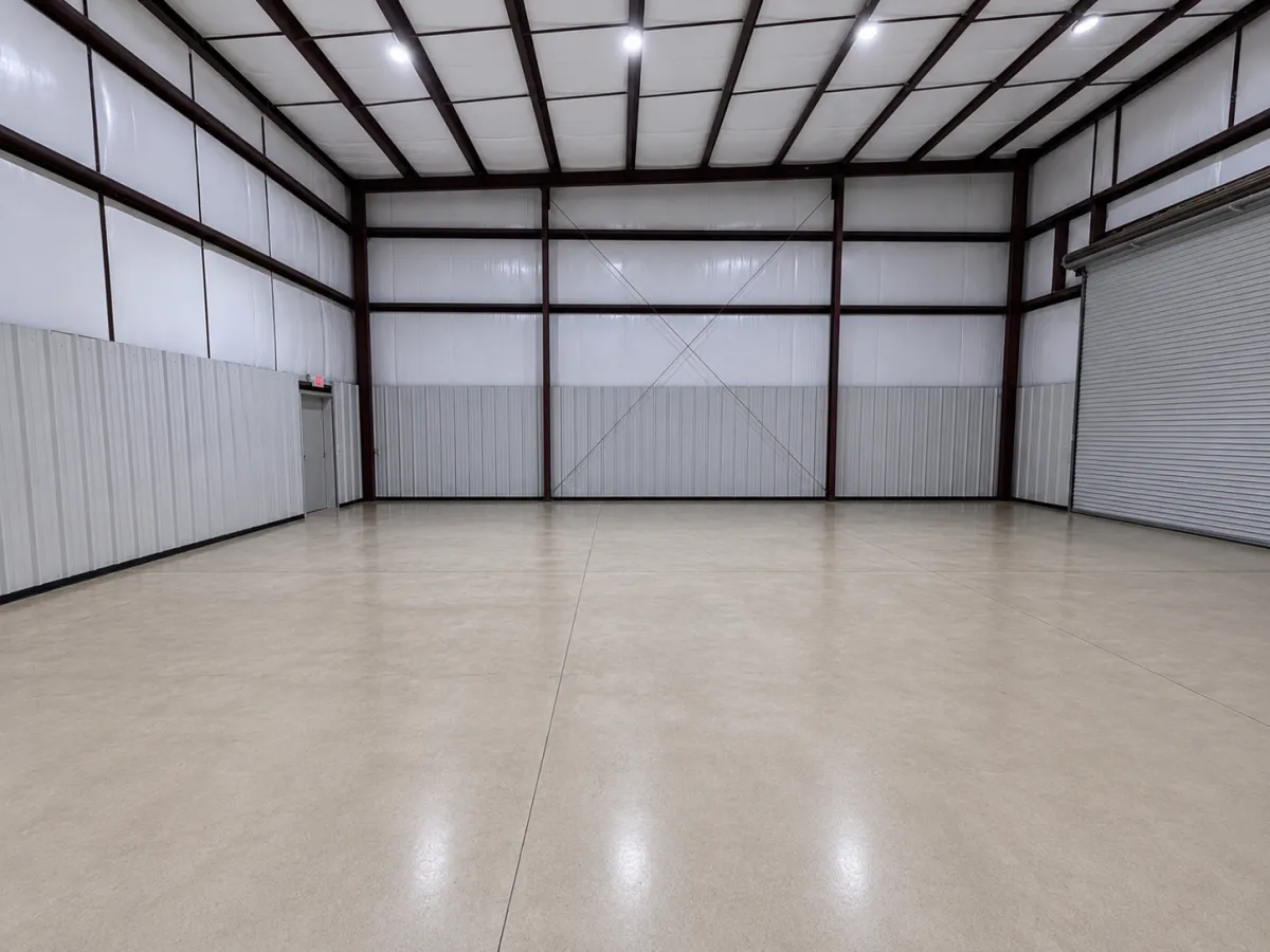 Interior warehouse space with polished concrete floor and roll-up door